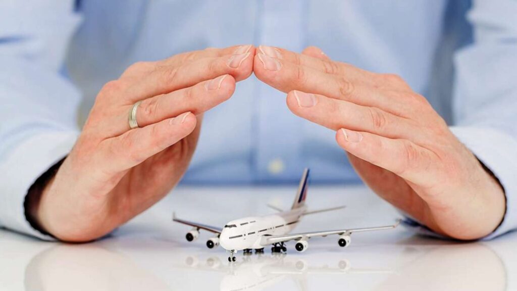 A man securing a toy plan showcasing common mistakes to avoid when booking a umrah package and travel insurance