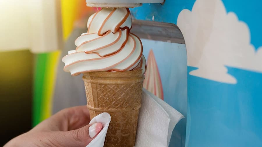 An ice cream coming from an ice cream machine